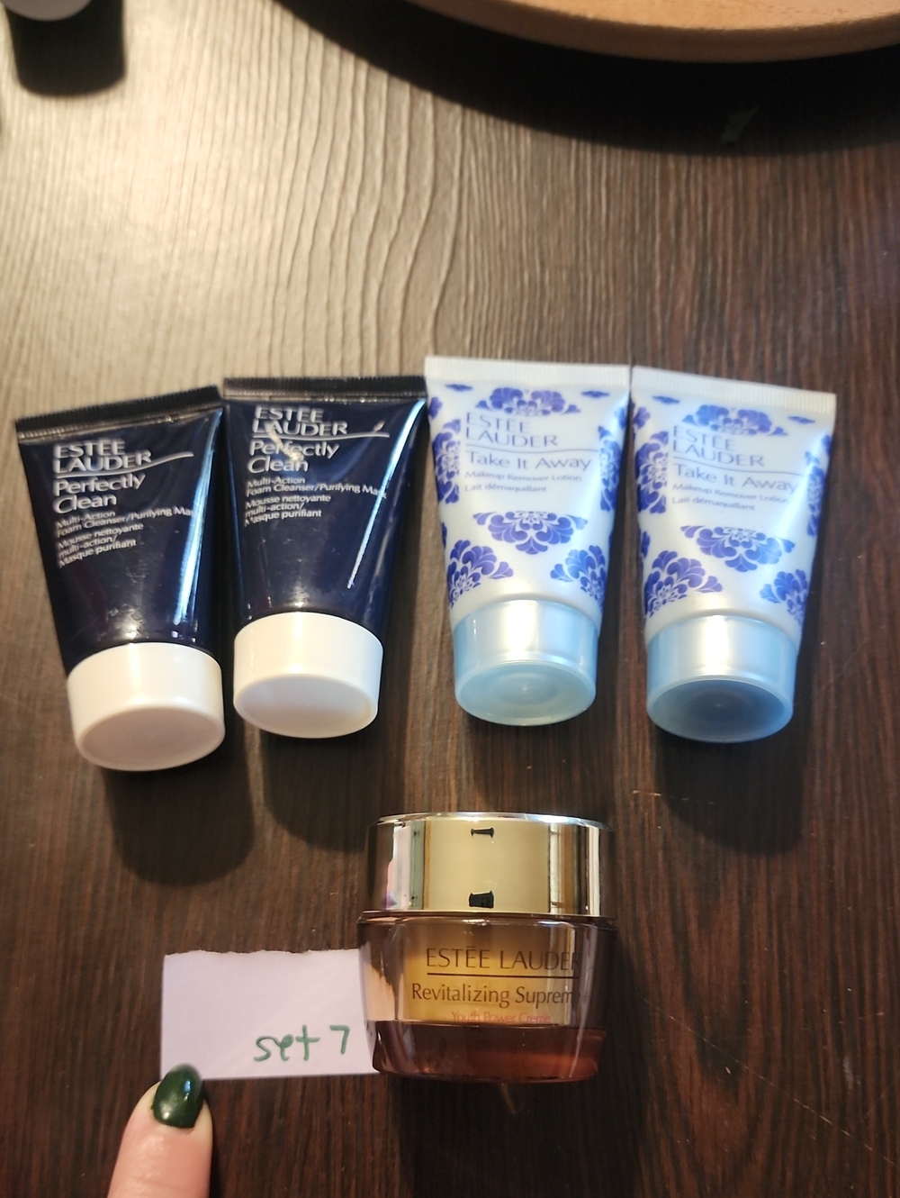 Estee Lauder skincare set with navy, light blue & brown tubes